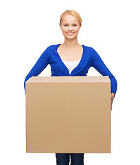 Image showing smiling woman in casual clothes with parcel box