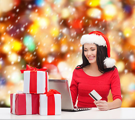 Image showing woman with gifts, laptop computer and credit card