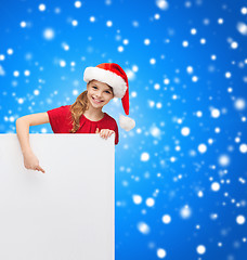 Image showing child in santa helper hat with blank white board