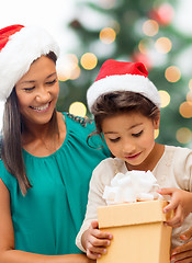 Image showing happy mother and child girl with gift box