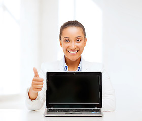 Image showing smiling woman with laptop computer