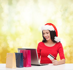 Image showing woman with gifts, laptop computer and credit card