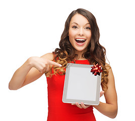 Image showing smiling woman in red dress with tablet pc