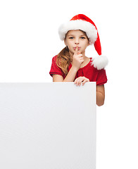 Image showing child in santa helper hat with blank white board
