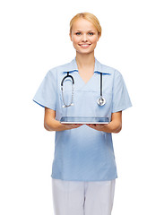 Image showing smiling female doctor or nurse with tablet pc