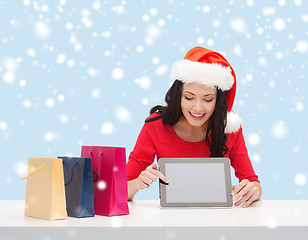 Image showing woman in santa helper hat with tablet pc