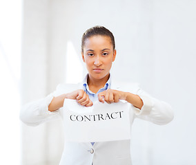 Image showing african businesswoman tearing contract