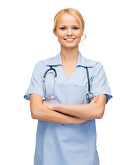 Image showing smiling female doctor or nurse with stethoscope