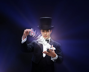 Image showing magician showing trick with playing cards