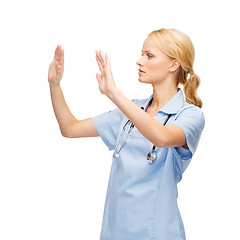 Image showing doctor or nurse working with virtual screen