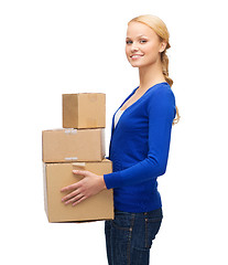 Image showing smiling woman in casual clothes with parcel boxes