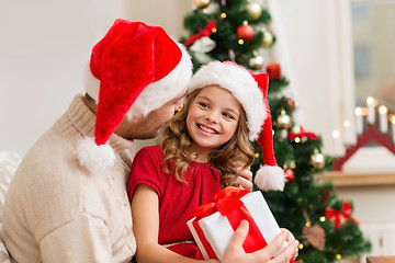 Image showing smiling father and daughter holding gift box