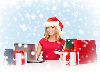 Image showing woman with gifts, laptop computer and credit card