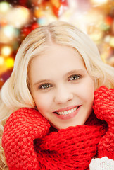 Image showing smiling teenage girl in red mittens and scarf