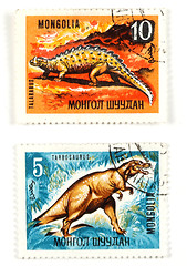 Image showing Dinosaurs on old postage stamps