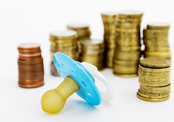 Image showing pacifier with hard money