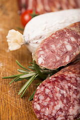 Image showing Smoked sausage with rosemary and peppercorns tomatoes and garlic