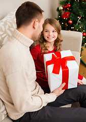 Image showing smiling father and daughter looking at each other