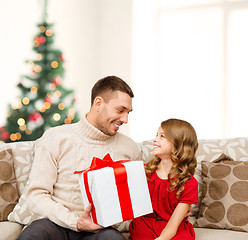 Image showing smiling father and daughter looking at each other