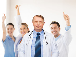 Image showing smiling doctor or professor with stethoscope