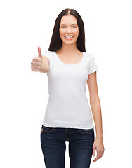 Image showing smiling woman in white t-shirt showing thumbs up