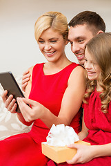 Image showing smiling family with tablet pc