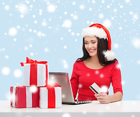 Image showing woman with gifts, laptop computer and credit card