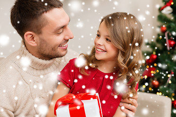 Image showing smiling father and daughter looking at each other