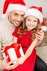 Image showing smiling father and daughter holding gift box