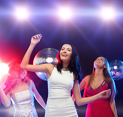 Image showing three smiling women dancing in the club