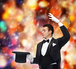 Image showing magician in top hat showing trick