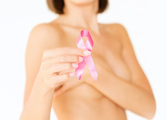 Image showing hand holding pink breast cancer awareness ribbon