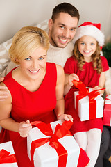 Image showing happy family opening gift boxes