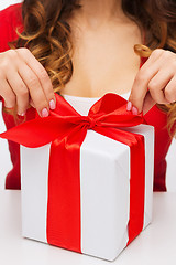 Image showing woman hands opening gift boxes