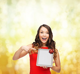 Image showing smiling woman in red dress with tablet pc