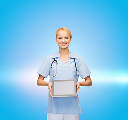 Image showing smiling female doctor or nurse with tablet pc