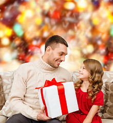 Image showing smiling father and daughter looking at each other