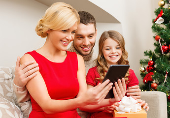 Image showing smiling family with tablet pc