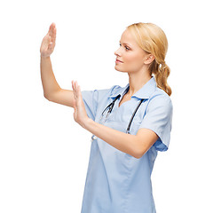 Image showing doctor or nurse working with virtual screen