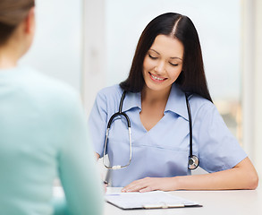 Image showing smiling doctor or nurse with patient