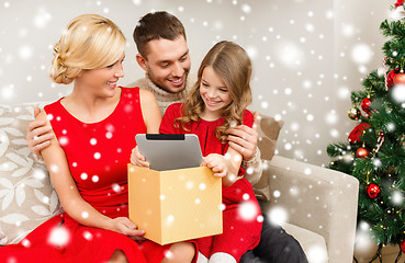 Image showing smiling family with tablet pc