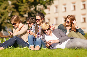 Image showing students looking at smartphones and tablet pc