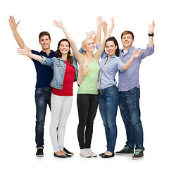 Image showing group of smiling students waving hands