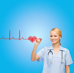 Image showing smiling doctor or nurse drawing cardiogram