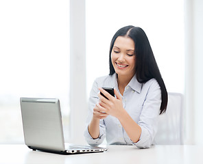 Image showing smiling businesswoman or student with laptop