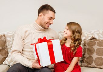 Image showing smiling father and daughter looking at each other