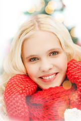 Image showing smiling teenage girl in red mittens and scarf