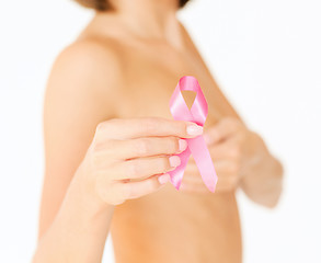 Image showing hand holding pink breast cancer awareness ribbon