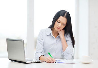 Image showing tired businesswoman or student with laptop