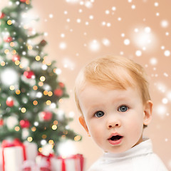 Image showing happy little boy with christmas tree and gifts